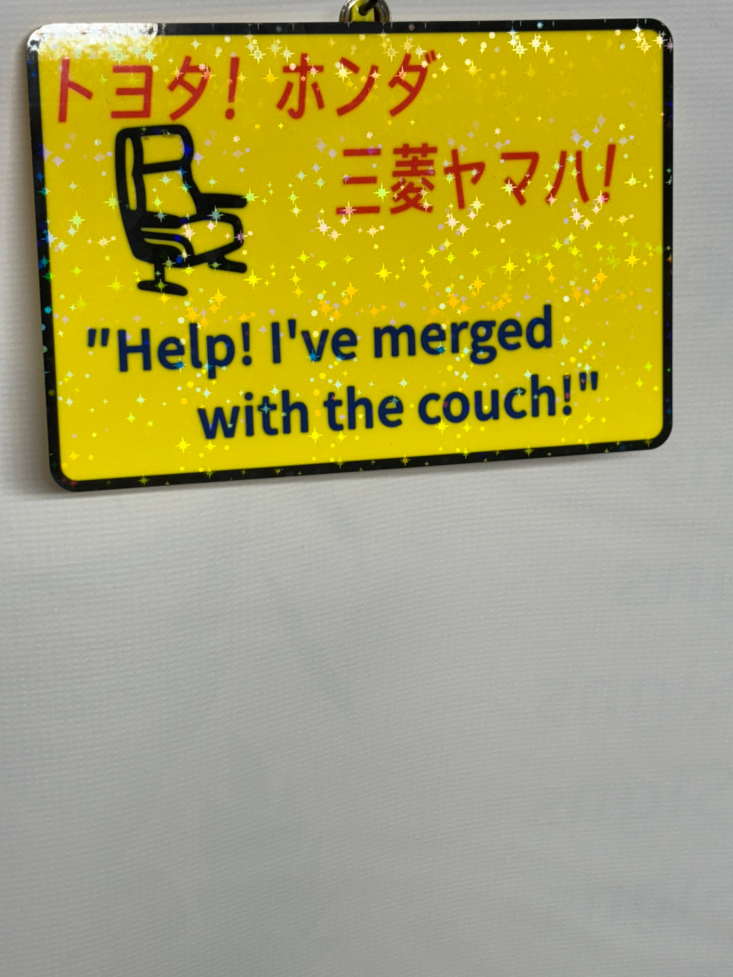"Help! I've merged with the couch!" Funny Japanese Sign